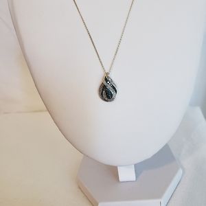 Blue stone and white diamond pendant